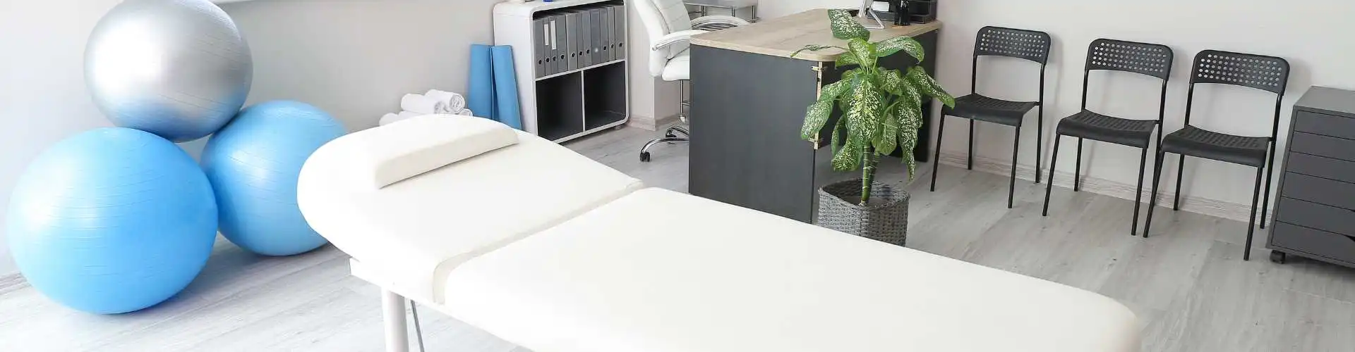 Dr. Mariah and Dr. Sam with a family at The Kingdom Chiropractic in Fishers